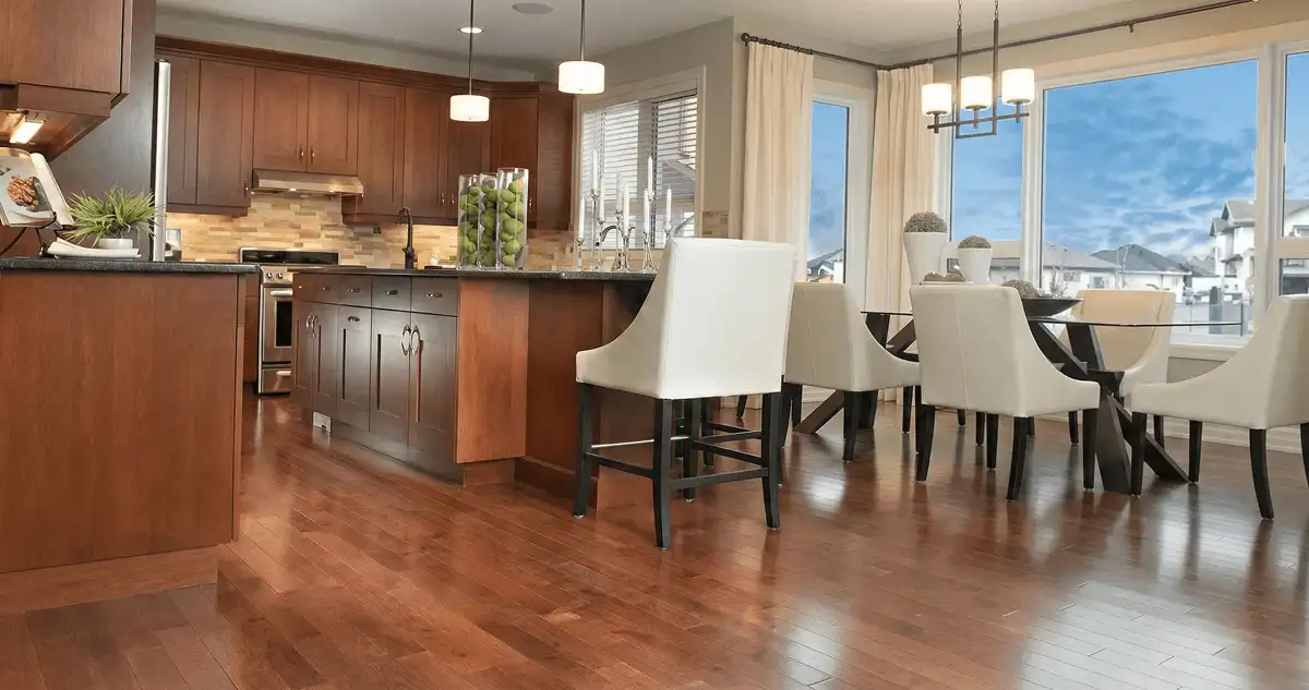 A modern kitchen with professionally installed wood flooring in Arvada, CO