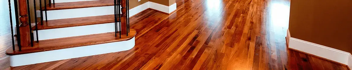 Base floor of a staircase with professionally restored wood flooring in Arvada CO