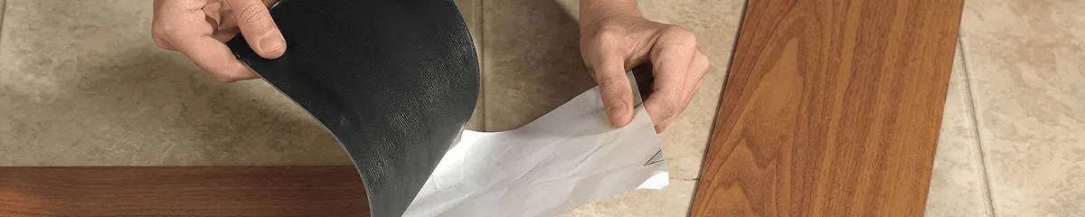 A professional installing vinyl flooring in Arvada, CO