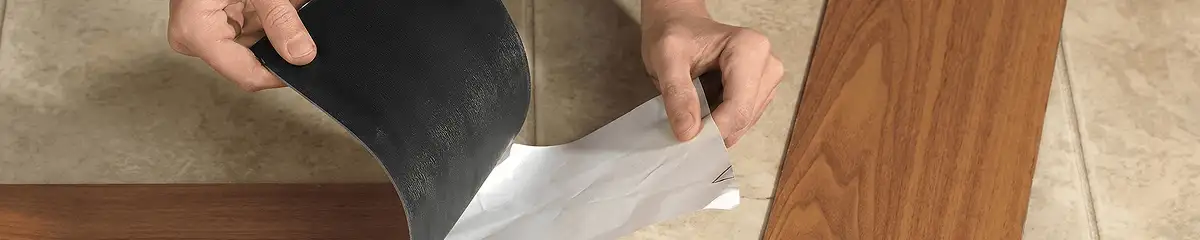 A professional installing vinyl flooring in Arvada, CO